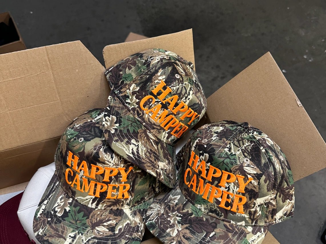 happy-camper-tree-camo-embroidered-trucker-hat-4549876.webp?v=1784233640&width=5760