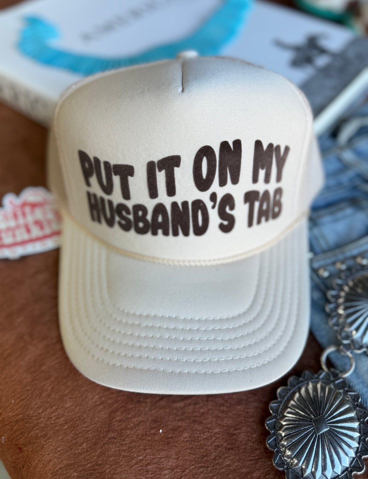 Put It On My Husband's Tab Trucker Hat