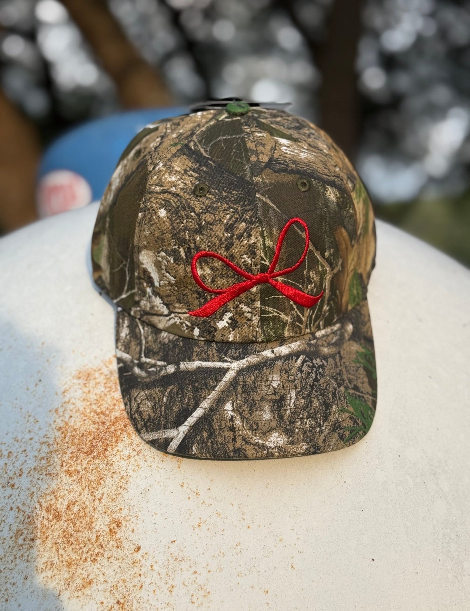 Red Bow Embroidered Tree Camo Trucker Hat
