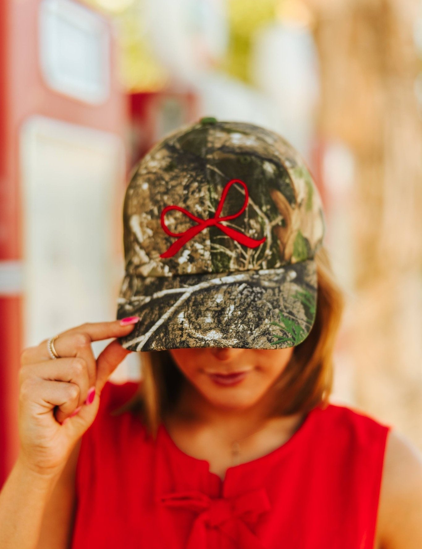 Red Bow Embroidered Tree Camo Trucker Hat