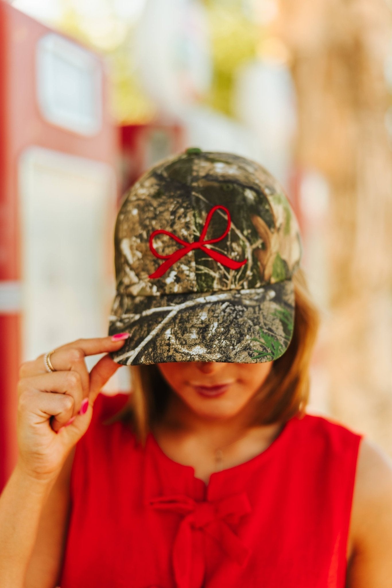 Red Bow Embroidered Tree Camo Trucker Hat