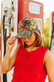 Red Bow Embroidered Tree Camo Trucker Hat