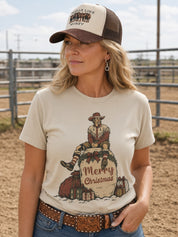 Model wearing Vintage Rodeo Clown Merry Christmas Graphic Tee at a rodeo arena