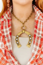 The Gilded Luck Horseshoe Pendant