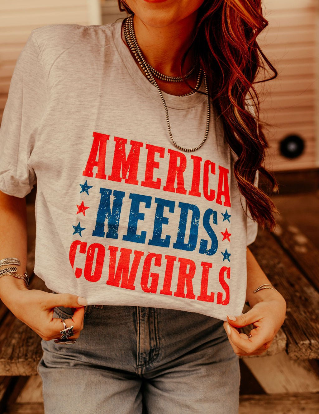 America Needs Cowgirls TeeWhiteS
